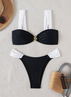 Biquíni Émilie. preto e branco elegante, alças grossas, laço nas costas e detalhe dourado central. Calcinha cheeky de cintura baixa. Sofisticação na praia.