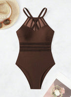 Realce suas curvas com o Maiô Virgínia. Design com transparência em tule na cintura, decote halter e costas cruzadas. O equilíbrio perfeito entre o sexy e o elegante.