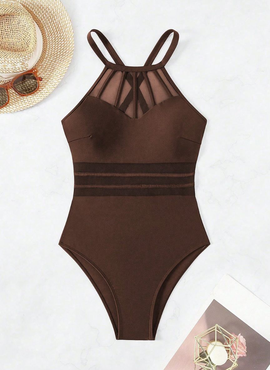 Realce suas curvas com o Maiô Virgínia. Design com transparência em tule na cintura, decote halter e costas cruzadas. O equilíbrio perfeito entre o sexy e o elegante.