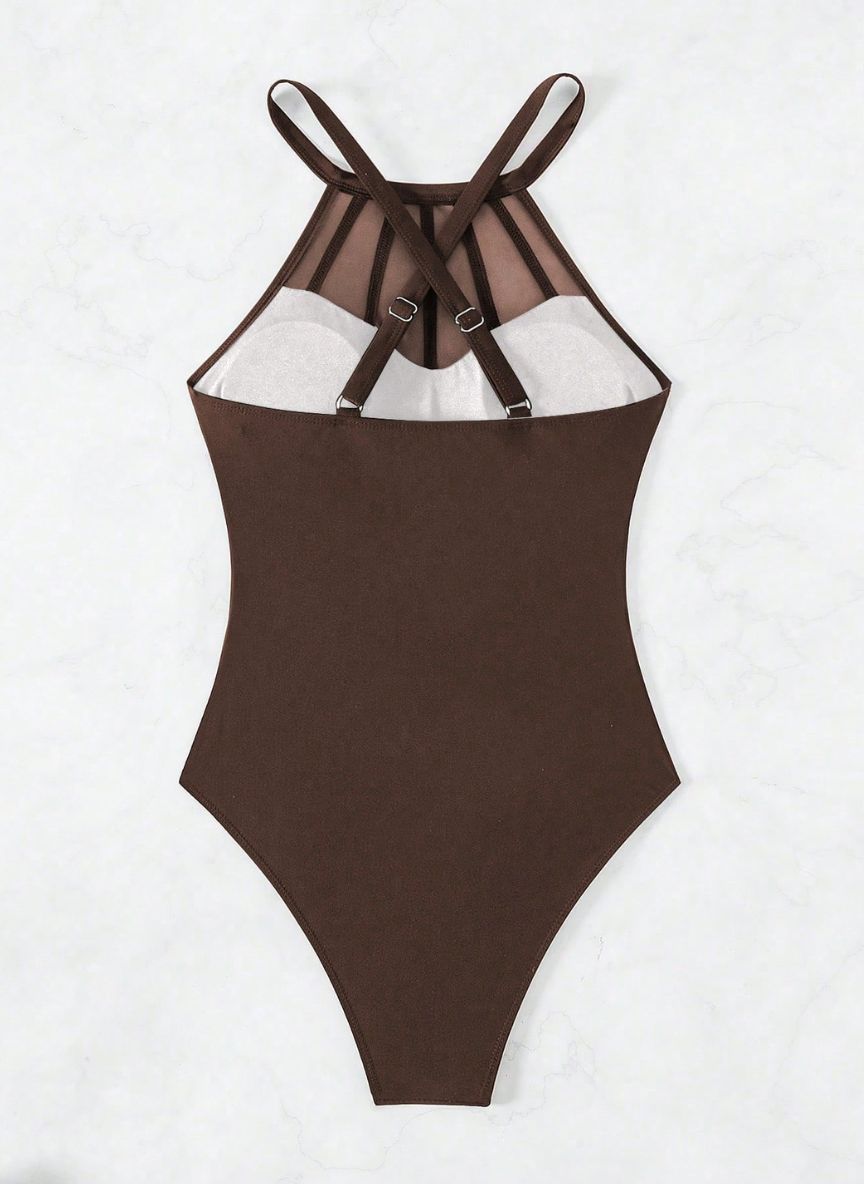 Realce suas curvas com o Maiô Virgínia. Design com transparência em tule na cintura, decote halter e costas cruzadas. O equilíbrio perfeito entre o sexy e o elegante.
