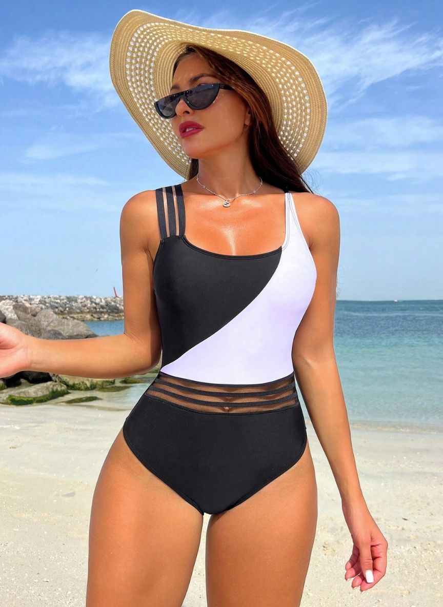 Realce sua silhueta com o Maiô Meyers, alças triplas exclusivas, faixas de tule que afinam a cintura e contraste P&B moderno. O luxo que você merece. Confira.